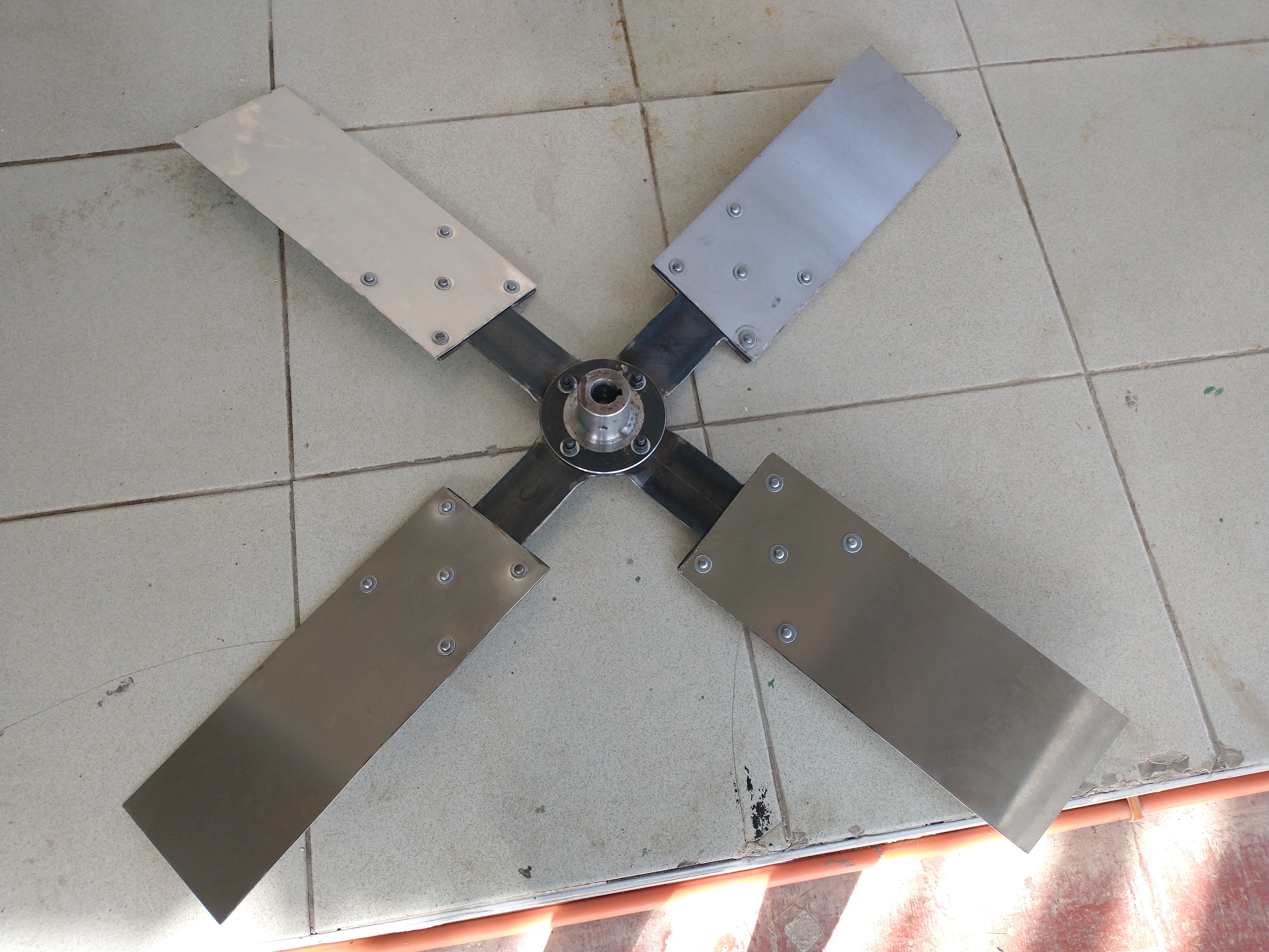 Finished industrial cooling fan blade on the workshop bench