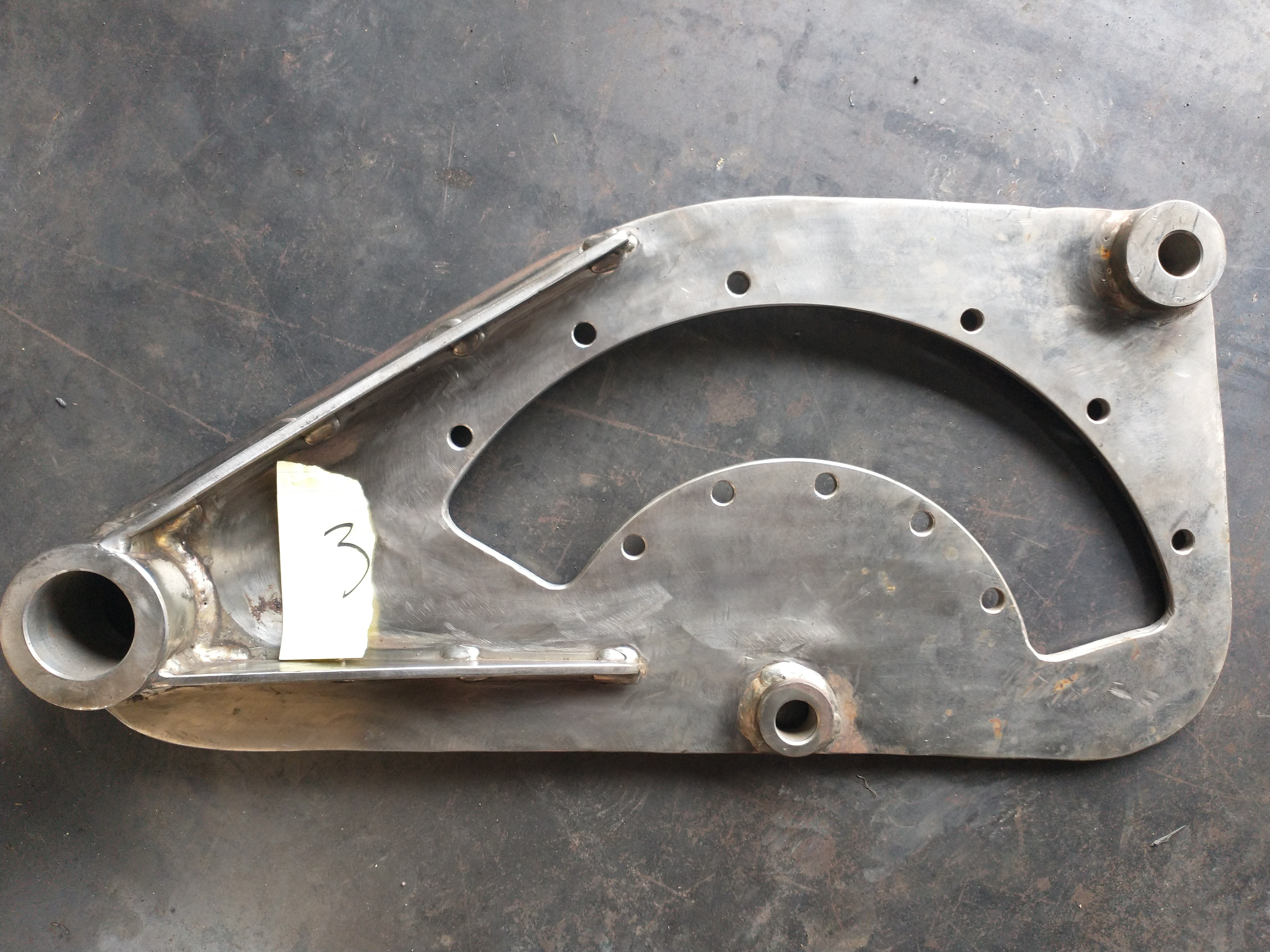 Mechanical linkage bracket fabricated from steel