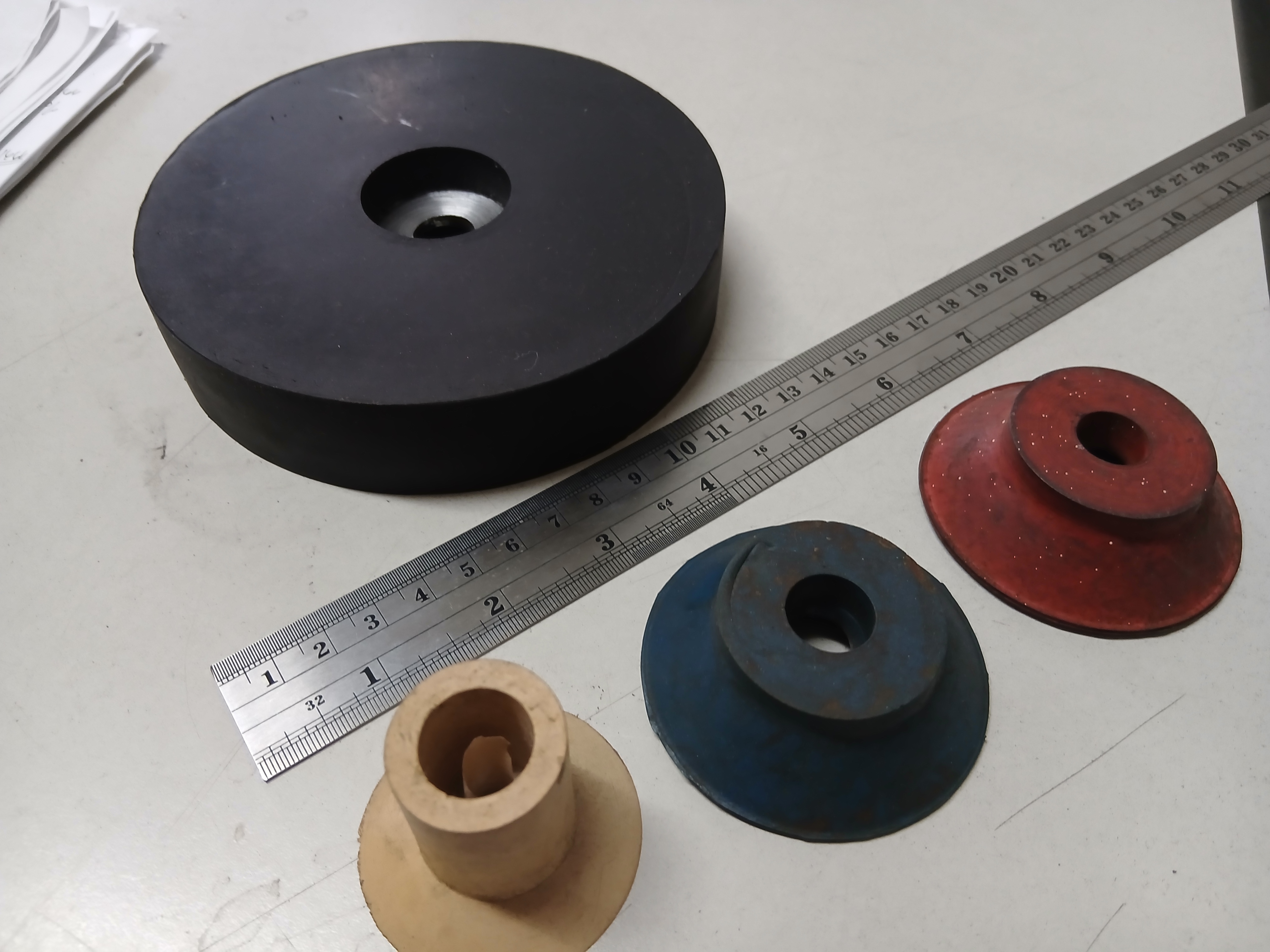 Rubber isolation mounts for a machine or base frame